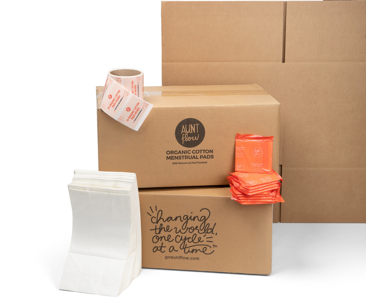 Aunt Flow organic cotton pad boxes with stickers, white paper bags and pads
