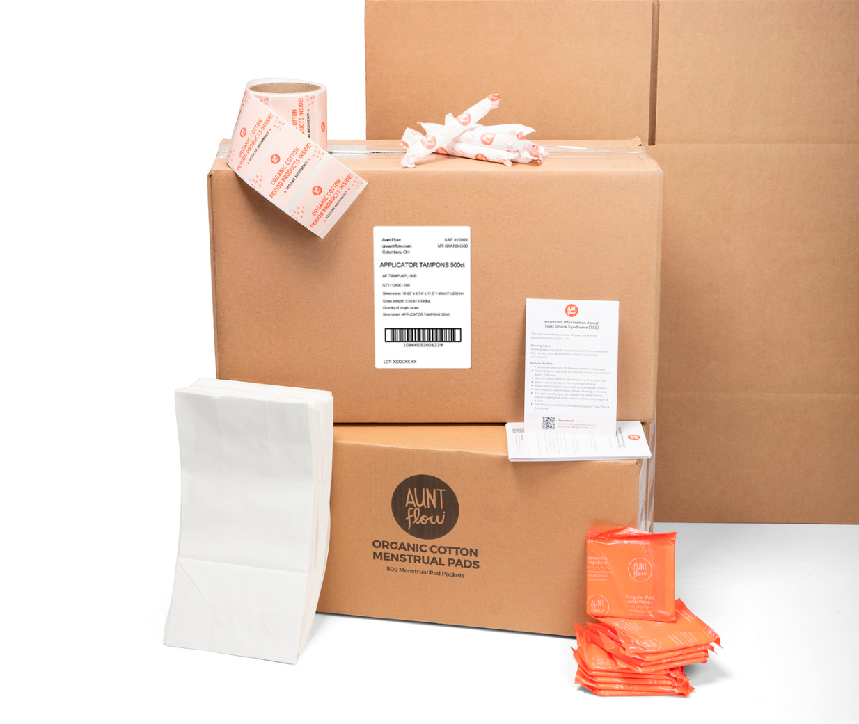 Aunt Flow organic cotton pad boxes and applicator tampons with stickers, white paper bags and pads